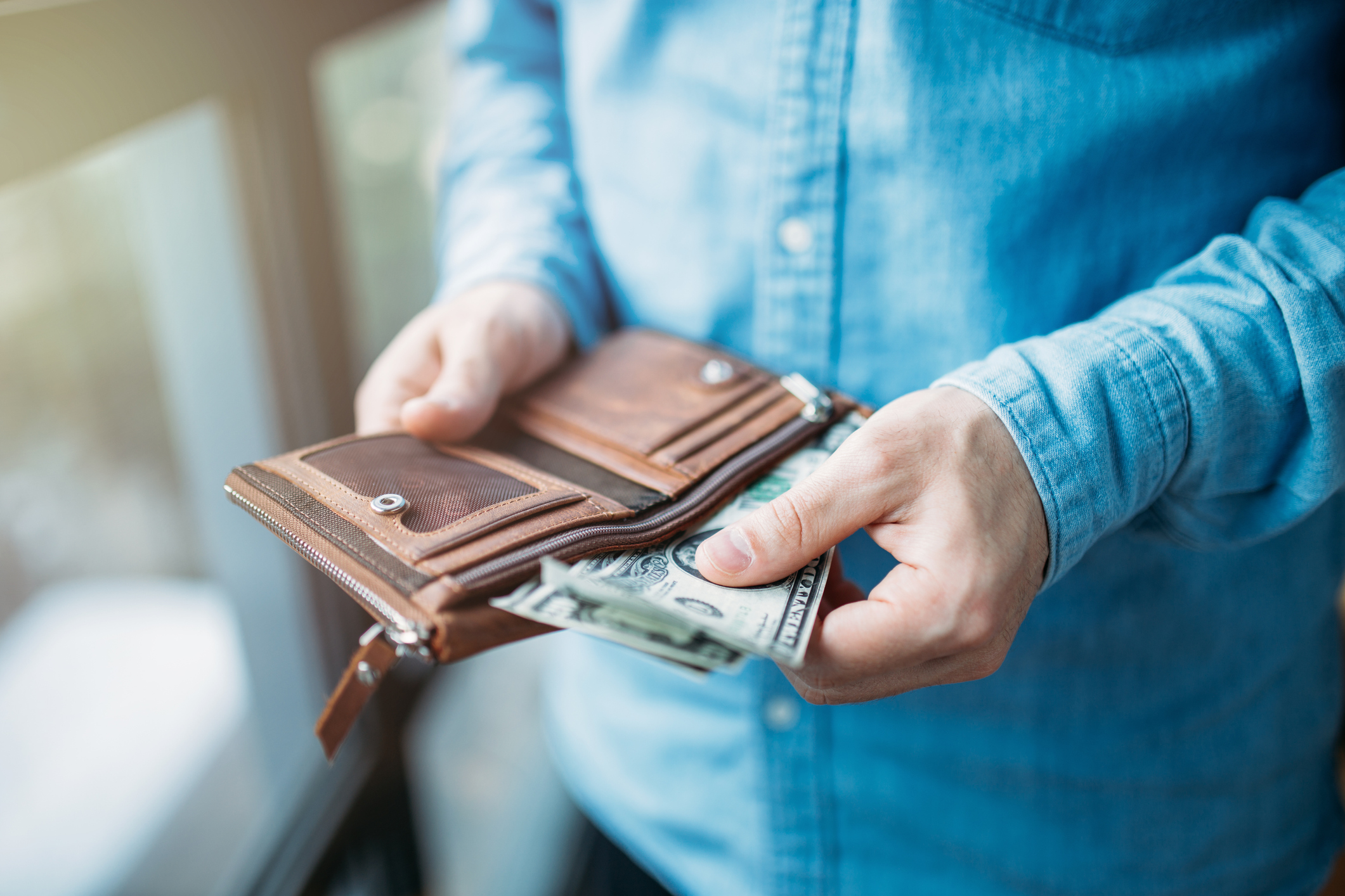 Man holding money banknote and counting